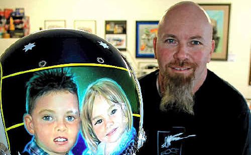 Warwick artist Steve Parker has just finished painting a helmet for V8 driver Craig Lowndes. Warwick artist Steve Parker has just finished painting a helmet for V8 driver Craig Lowndes.